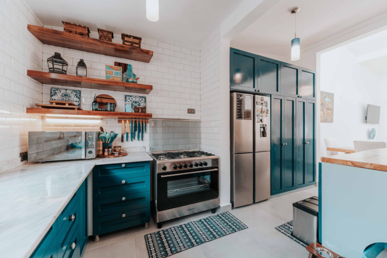 An aesthetic kitchen with Emerald green kitchen cabinets