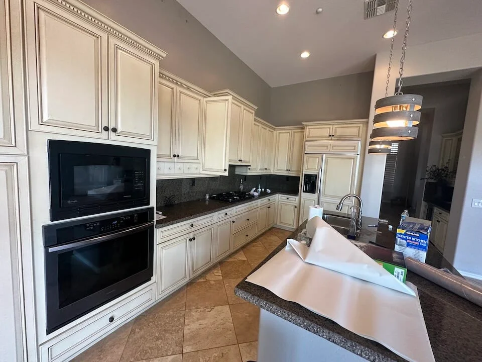 A kitchen with refinished cabinets