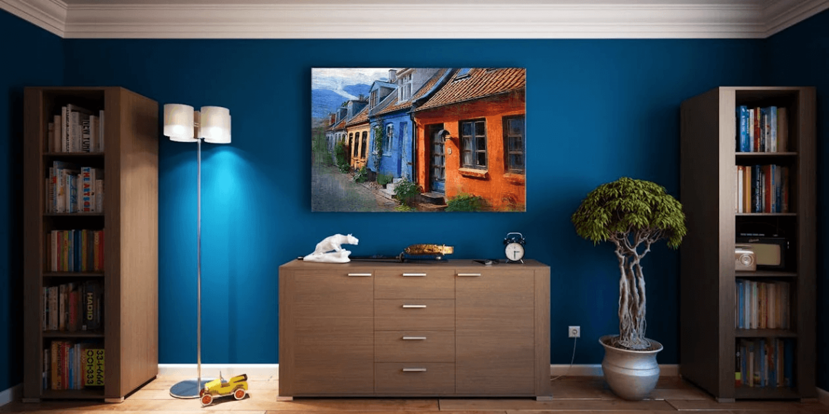 A room with shelves, drawers, and a painting