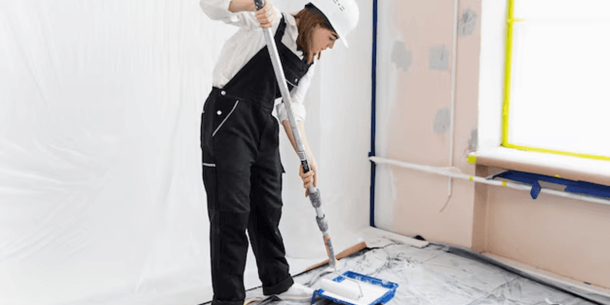 A woman painting the interior of a house