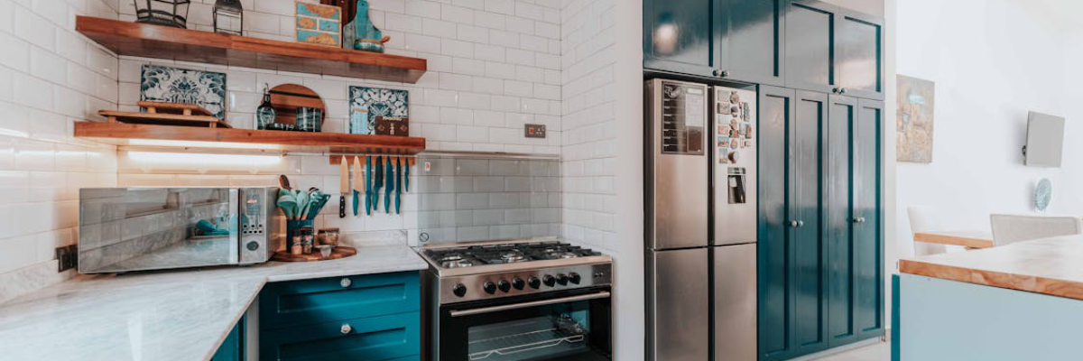 An aesthetic kitchen with Emerald green kitchen cabinets