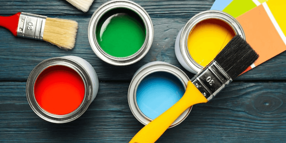 Buckets of paints and paint brushes